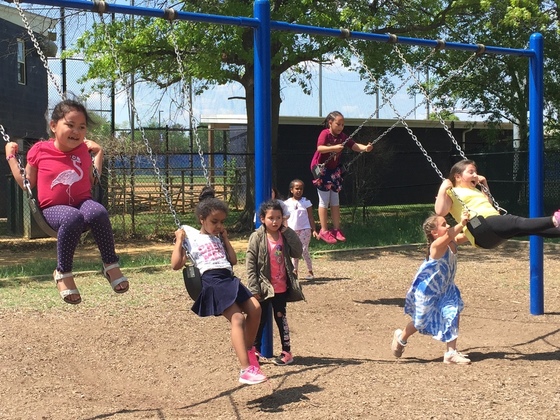 Photo of students on swings