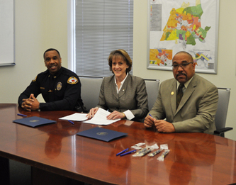 Leesburg Chief of Police Gregory Brown, Leesburg Mayor Kelly Burk and Loudoun County Branch of the NAACP President Phillip Thompson