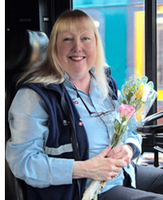Metro bus driver with flowers