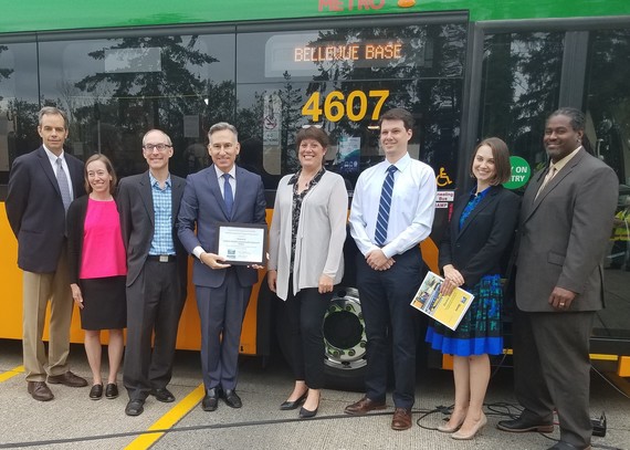 Councilmember Balducci with Executive Dow Constantine and others in front of an electric bus