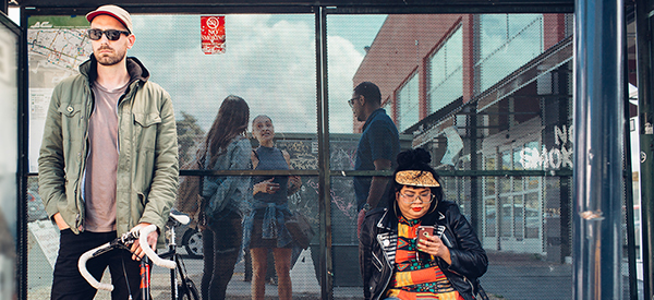 Two people waiting for the bus