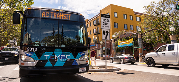 Tempo bus driving on International Blvd. 