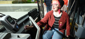 Woman paying fare on AC Transit Bus