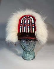 black and red Alutiiq hat with cream fur trim