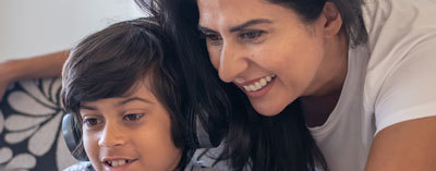 mother and child looking at screen