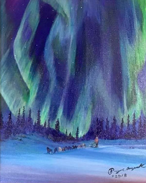dog team underneath the northern lights in the snow