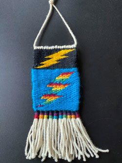 weaving with azure background and rainbow accents