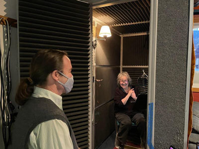 Ernestine Hayes and project director Scott Burton using a vocal booth 