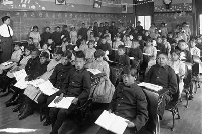 A first- and second-grade class at the Genoa Indian Industrial School in Genoa, Neb., in 1910.