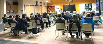 Lende talks to an audience at the Kodiak Public Library