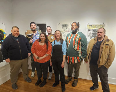 Łuk’ae Tse’ Taas collective at the Bunnell Street Arts Center, with director Adele Person (center)