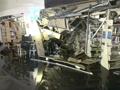 Damage inside the Palmer Public Library after a portion of the roof collapsed Wednesday, Feb. 15, 2023. 