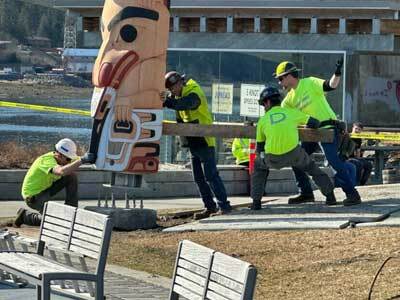 A totem pole carved by Gyibaawm Laxha David Robert Boxley is raised