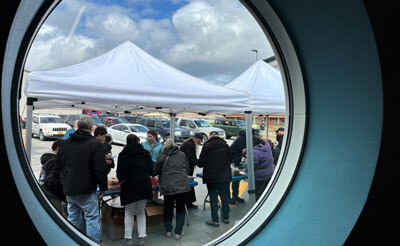 people gather outside for Unalaska Public Library opening