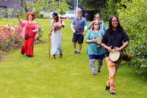 Hannahadina Kuhnert leads a music procession outside the Mendenhall Valley Public Library 