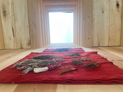A seclusion hut constructed by Yéil Yádi Olson in collaboration with curator and healer Meda DeWitt. 
