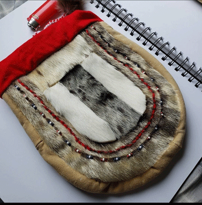 fur pouch with red accents made by Golga Oscar