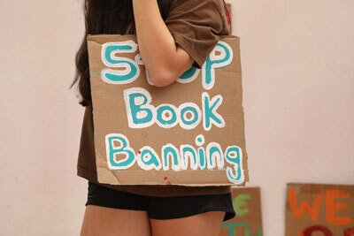 A student holds a sign that reads “Stop Book Banning” at a rally in Florida