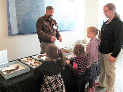 Steve Lanford, volunteer archaeologist, answers questions about artifacts from the museum’s collections.