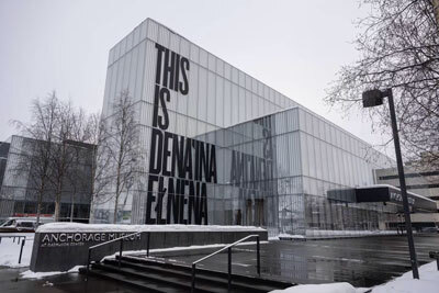 Lettering on the Anchorage Museum reminds visitors that Anchorage is the traditional homeland of Dena’ina people. 