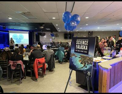 The audience listens to one of several brief science presentations in The Pub at the University of Alaska Fairbanks 