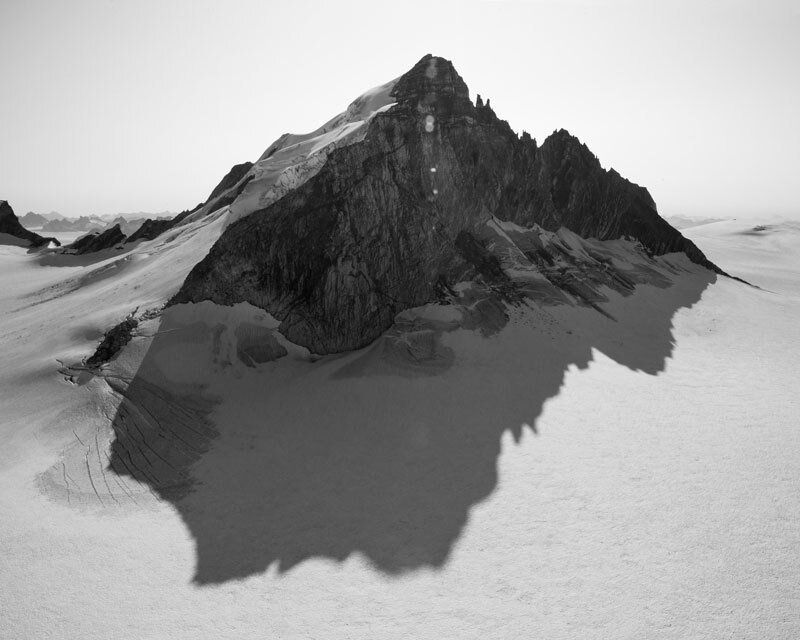 black and white image of jagged peak and shadow