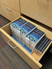 Copies of "The Cold Millions," this year’s NEA Big Read book at the Homer Public Library 