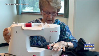 Susan Malutin at the sewing machine