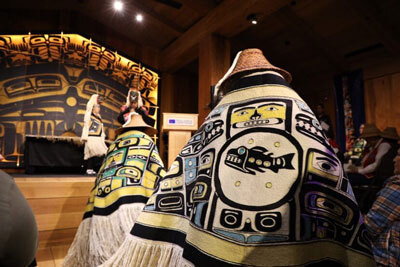 Dancers enter the Walter Soboleff Building in the Shuká Hít clan house during a Chilkat robe homecoming ceremony