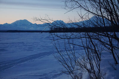 Denali, Mount Hunter and Mount Foraker are seen from the frozen Talkeetna River on the evening of March 9, 2024.