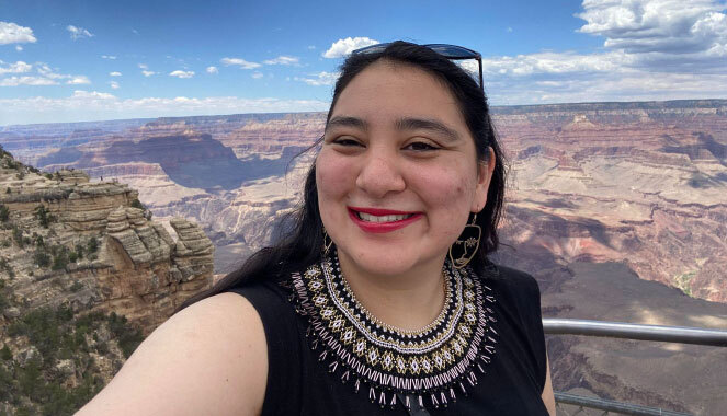 Lisa Kamahamak Lynch wears a beaded necklace she made. Grand Canyon is in the background.