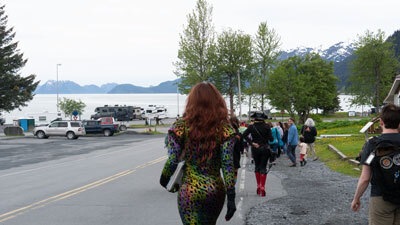 Drag queen Totally Tiff walking with story hour participants after evacuating from the Seward Community Library and Museum