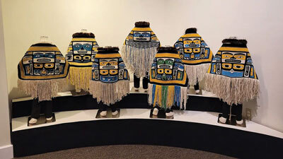 Child-sized Chilkat robes woven using a complex finger-twining process on display in the exhibition "For Our Children."