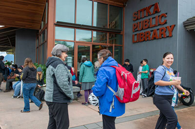 Sitkans congregate outside the town library to tap into free Starlink-based internet. 