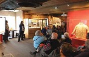 Molly Odell of the Alutiiq Museum and Margaret Greutert of the Kodiak History Museum talk 