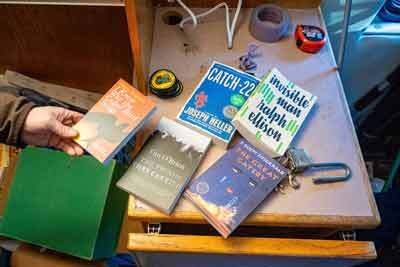 Alaska Bookmobile founder Jimmy Riordan displays banned books inside the Alaska Bookmobile 