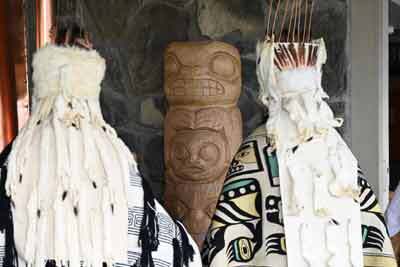 Dancers sing at a rededication ceremony of he Porcupine and Beaver Totem Pole at the Mendenhall Glacier Visitor Center 