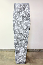coffin covered in grey and white flora pattern