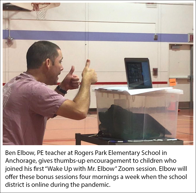 Ben Elbow, PE teacher at Rogers Park Elementary School, Anchorage, gives thumbs-up to kids who joined his first “Wake Up with Mr. Elbow” Zoom session