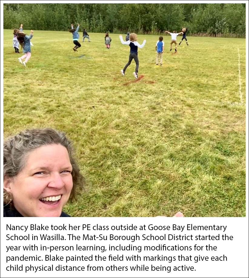 Nancy Blake at Goose Bay Elementary School, Wasilla painted an outdoor field with marks to keep class distanced while being active in her PE class