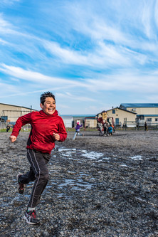 Boy running in Unalakleet Alaska Healthy Futures Challenge
