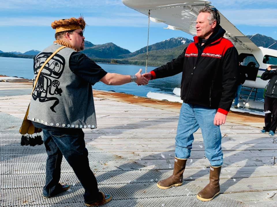 Governor Dunleavy arriving in a community by seaplane