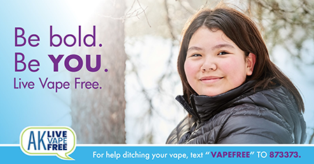 Image of an AK Native teen girl walking through snowy winter trees. AK Live Vape Free - for help ditching your vape text VAPEFREE to 873373