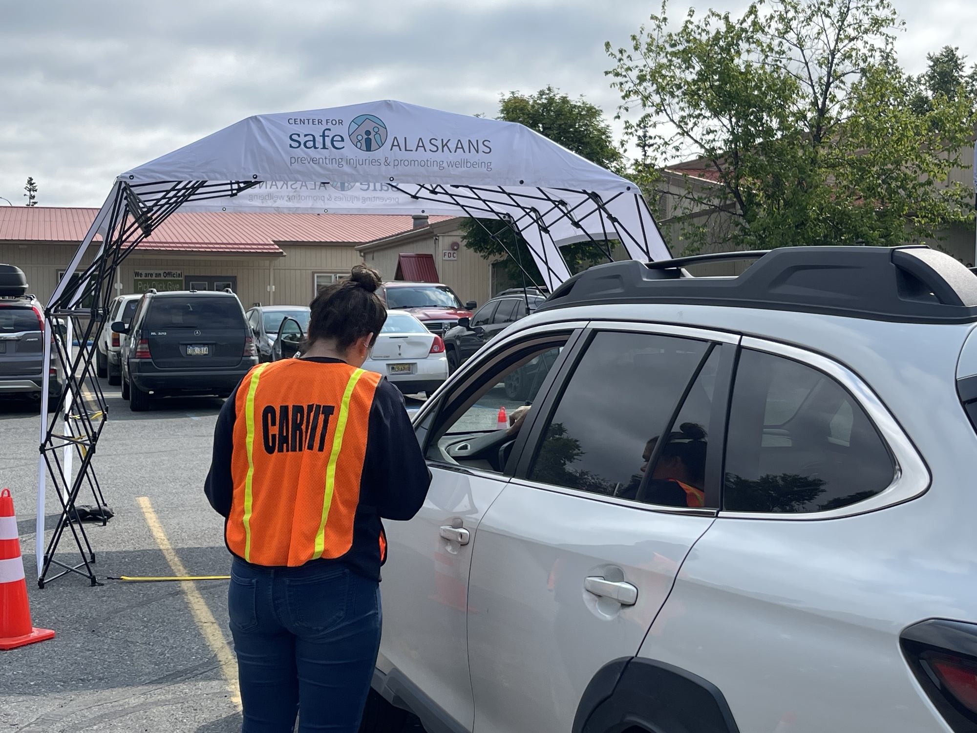 CarFit set up in parking lot greeting driver in vehicle image