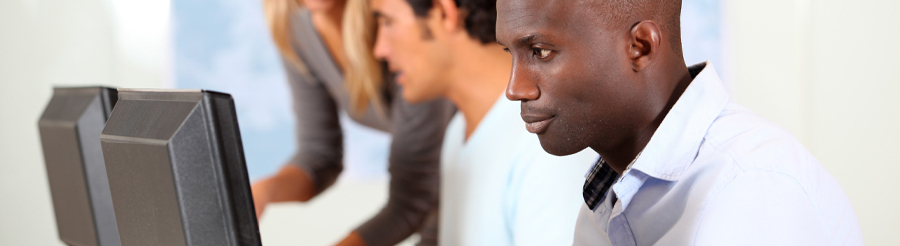 man typing at a computer