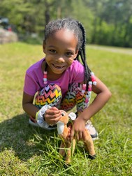 Cheaha Field Trip Student with Toy Deer