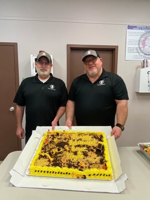 Bruce and Wayne retirement photo with cake