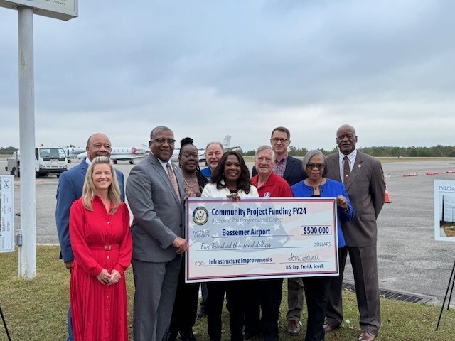 Commissioner Terri Sewell check presentation to Bessemer Airport for $500,000