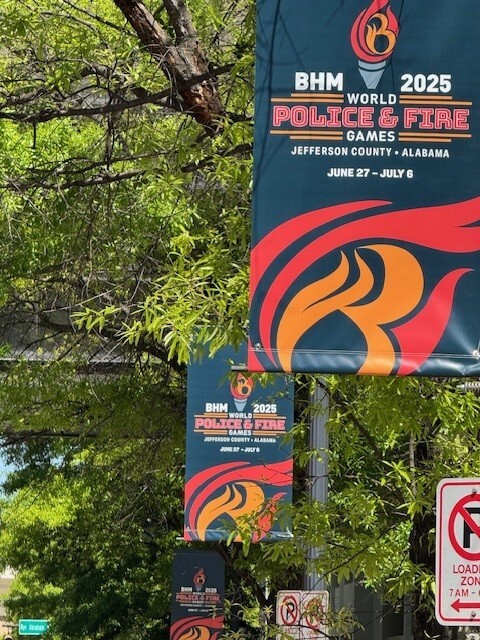 image of new banners outside of the courthouse for the World Police and Fire Games - dates June 27-July 6