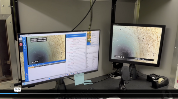image of 2 computer screens showing real time video from inside a sewer line